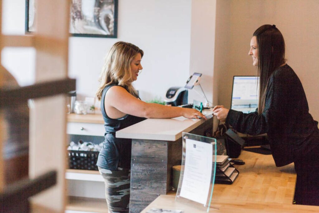 client checking in at Catalyst Chiropractic in Charlotte, NC